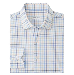 The Peter Millar Warren Crown Lite Cotton-Stretch Sport Shirt is a folded long-sleeve button-up with a light blue, orange, and white plaid pattern, a front pocket, and an easy-care label inside the collar.