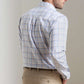 A man is shown from the back wearing a Peter Millar Warren Crown Lite Cotton-Stretch Sport Shirt in light blue and tan plaid, tucked into tan pants.