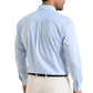 A man is seen from the back wearing the Peter Millar Langley Crown Lite Cotton-Stretch Sport Shirt in light blue stripes with beige pants.