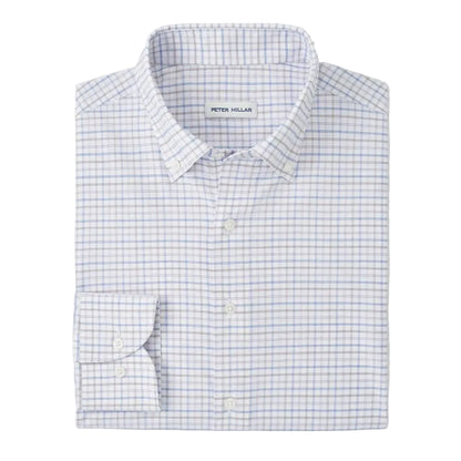 The Rommel Performance Twill Sport Shirt by Peter Millar features a folded, long-sleeve design in light blue and gray plaid, crafted from soft performance fabric for comfort and style.