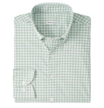 The folded Lewis Performance Twill Sport Shirt by Peter Millar is green and white checkered, features a collar and single cuff, and is crafted from performance fabric with UPF 50+ protection.