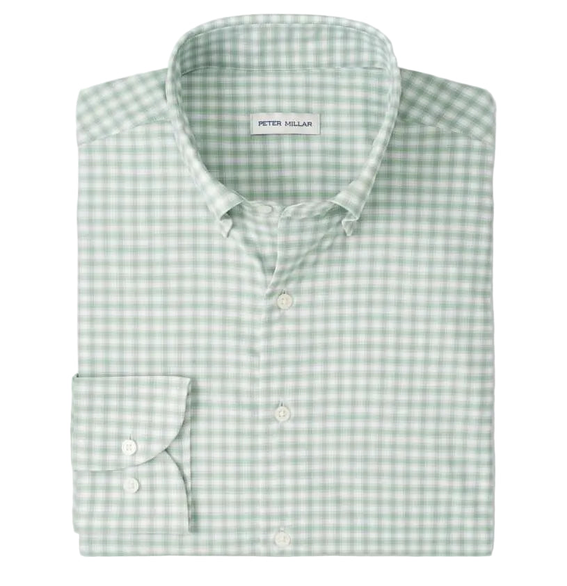 The folded Lewis Performance Twill Sport Shirt by Peter Millar is green and white checkered, features a collar and single cuff, and is crafted from performance fabric with UPF 50+ protection.