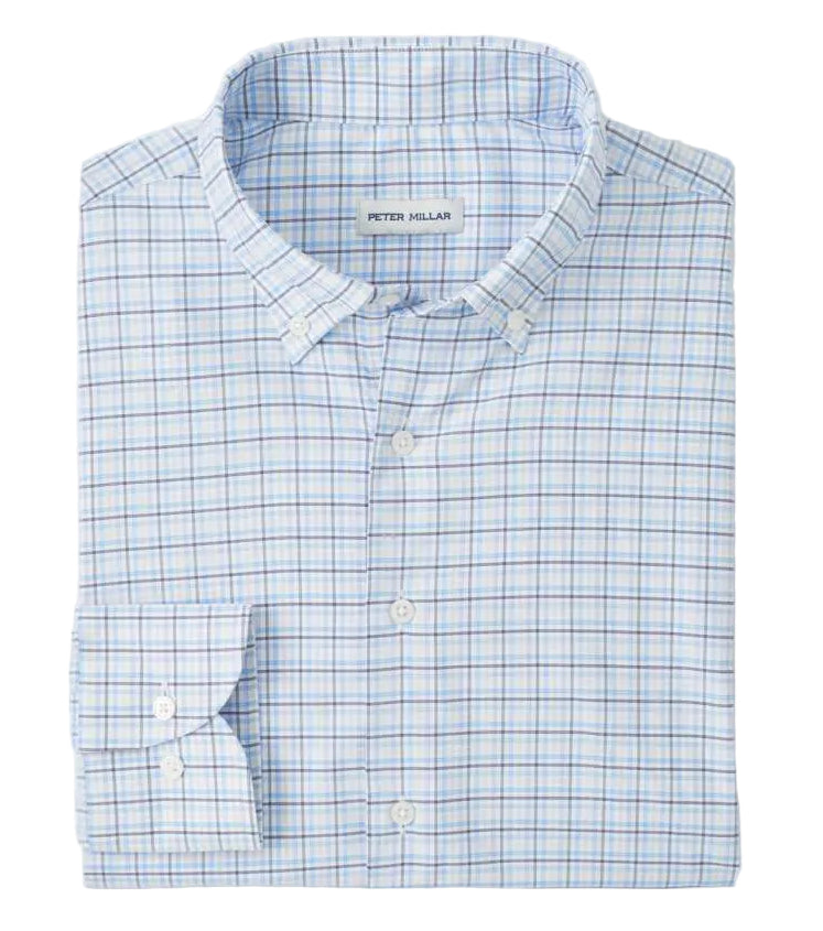 The Casey Performance Twill Sport Shirt by Peter Millar is a neatly folded long-sleeve button-down in light blue and white plaid, crafted from performance fabric. The label inside the collar reads "Peter Millar.