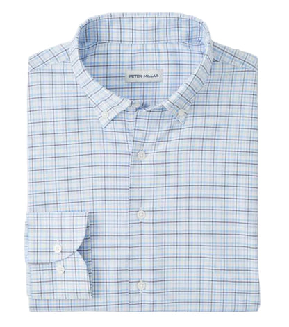 The Casey Performance Twill Sport Shirt by Peter Millar is a neatly folded long-sleeve button-down in light blue and white plaid, crafted from performance fabric. The label inside the collar reads "Peter Millar.