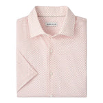 The Tamarama Cotton Lyocell Sport Shirt by Peter Millar is a light pink, featherweight, short-sleeve button-up featuring a small repeating geometric pattern and a visible "Peter Millar" label inside the collar.