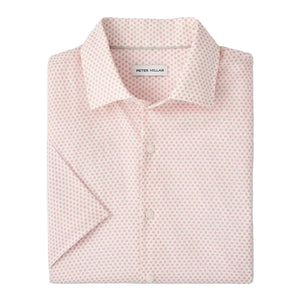 The Tamarama Cotton Lyocell Sport Shirt by Peter Millar is a light pink, featherweight, short-sleeve button-up featuring a small repeating geometric pattern and a visible "Peter Millar" label inside the collar.
