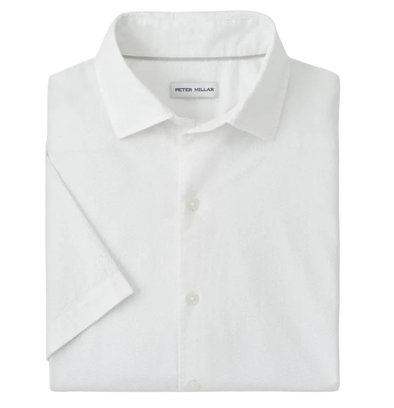 A neatly folded Peter Millar Seaward Cotton Lyocell Sport Shirt with short sleeves, a collar, and a visible inside brand label.