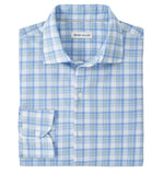 A folded Peter Millar Waterrock Cotton Lyocell Sport Shirt features blue, green, and white plaid, long sleeves, button-down front, and featherweight fabric for all-day comfort.
