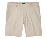 The Bingham Performance Short by Peter Millar in beige is a wrinkle-resistant, knee-length style featuring belt loops, front pockets, and a zipper fly, shown laid flat on a white background.