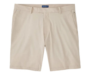 The Bingham Performance Short by Peter Millar in beige is a wrinkle-resistant, knee-length style featuring belt loops, front pockets, and a zipper fly, shown laid flat on a white background.