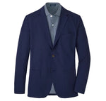 The Peter Millar Bingham Performance Blazer, in navy blue with notch lapels, two front pockets and single-button closure, is crafted from ultra-lightweight fabric and styled over a blue and white striped collared shirt.
