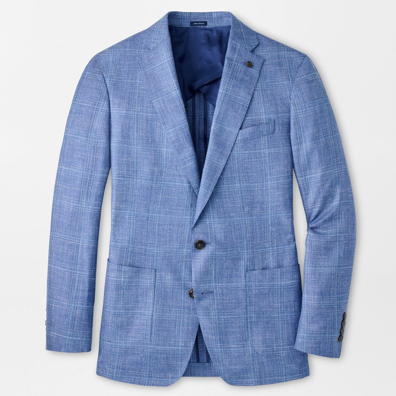 The Reynolds Plaid Soft Jacket by Peter Millar is a European-crafted, light blue plaid wool blazer with notch lapels, front pockets, and two buttons, shown laid flat on a white background.