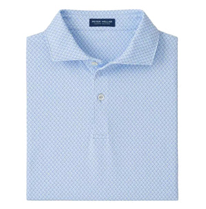 A neatly folded Peter Millar Mayfield Performance Jersey Polo in light blue, featuring a subtle geometric pattern, classic collar, and four-way stretch for all-day comfort.