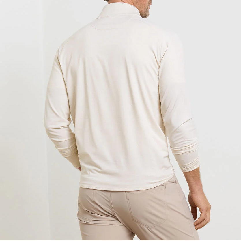A man is shown from the back against a white background, wearing the Peter Millar Stealth Stripe Performance Quarter-Zip in light beige with matching pants.