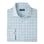 The Peter Millar Tropea Italian Poplin Sport Shirt is a folded long-sleeve shirt in light blue and green plaid, made from lightweight Italian cotton poplin, featuring the Peter Millar label inside the collar.