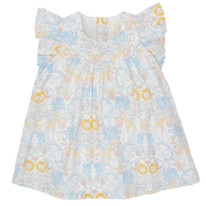 The Magnetic Me Girls' Cotton Poplin Easy Peasy Sleeveless Dress is made from white organic cotton and features ruffled shoulders with pastel yellow, blue, and pink animal and floral patterns.