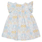 The Magnetic Me Girls' Cotton Poplin Easy Peasy Sleeveless Dress features pastel lions, giraffes, and florals on white poplin, made from soft organic cotton for your baby’s comfort.