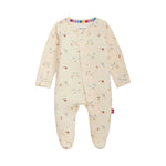 The Magnetic Me Baby Special Delivery Magnetic Footie is a cream-colored, long-sleeve onesie adorned with a small animal print, featuring closed feet and a row of secure magnetic closures down the front—offering convenience and cozy comfort for your little one.