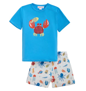 Magnetic Me Boys’ Deep Chic Magnetic Top & Short Set featuring a blue short-sleeve TENCEL modal t-shirt with a crab graphic and white shorts decorated with colorful sea creatures like octopuses, crabs, and jellyfish.