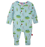 The Magnetic Me Baby Boys’ Gopher It Coverall is a light blue long-sleeve onesie, crafted from soft, sustainable modal fabric and adorned with a golf-themed print featuring golf clubs, flags, trees, nets, and playful cartoon animals; it features snap buttons down the front for easy dressing.