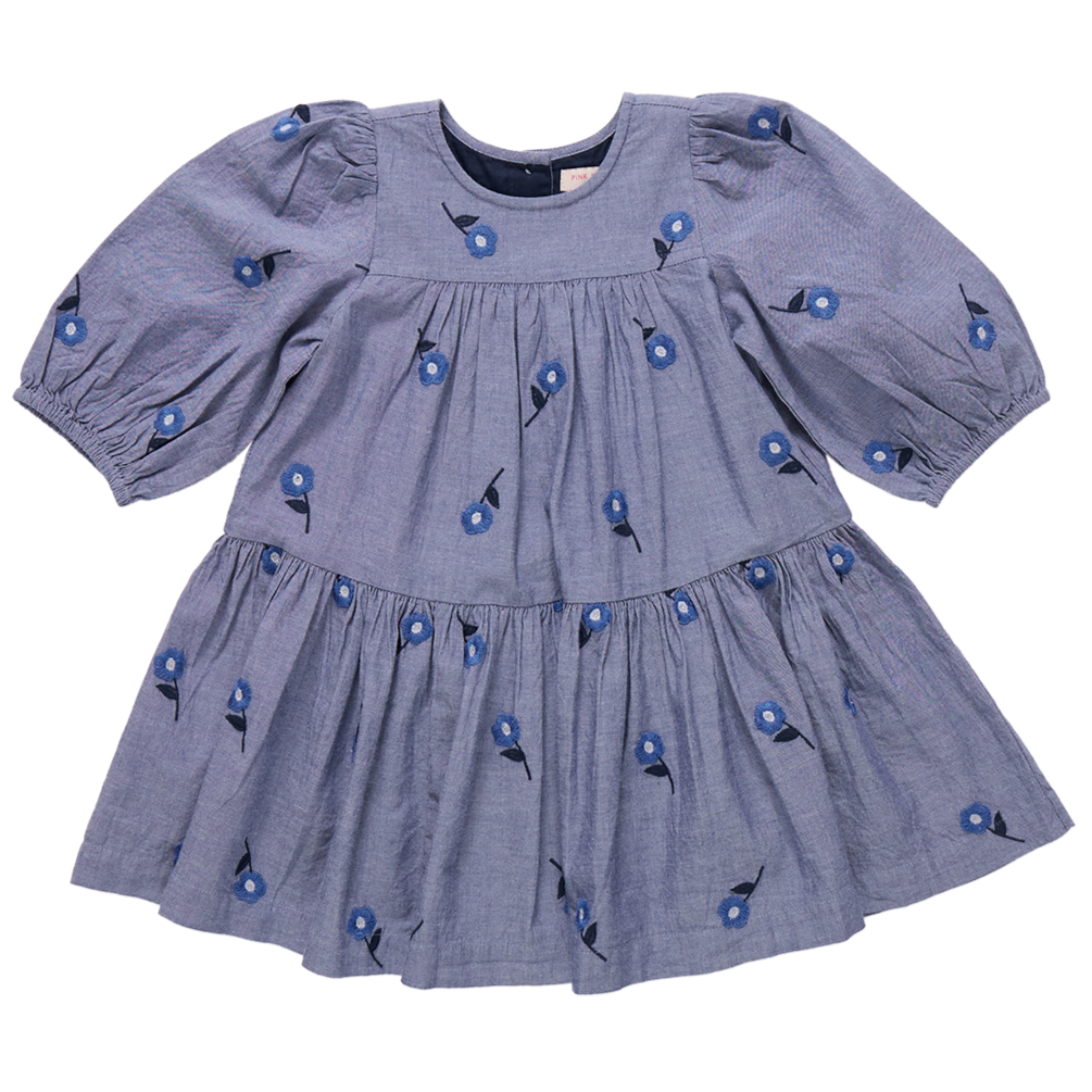 The Girls' Fiona Dress by Pink Chicken features long sleeves, puffed shoulders, a gathered skirt, and a round neckline with beautiful Blue Blossom floral embroidery.