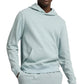 A person wearing an Onia Terry Pullover Hoodie in light blue heavyweight cotton with matching sweatpants, hands in the front pocket.