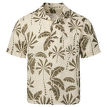 Unwind with Onia's Air Linen Vacation Shirt, a short-sleeve, button-up crafted from airy linen. Its beige background adorned with a green tropical leaf print offers relaxed comfort, making it an essential for any getaway.