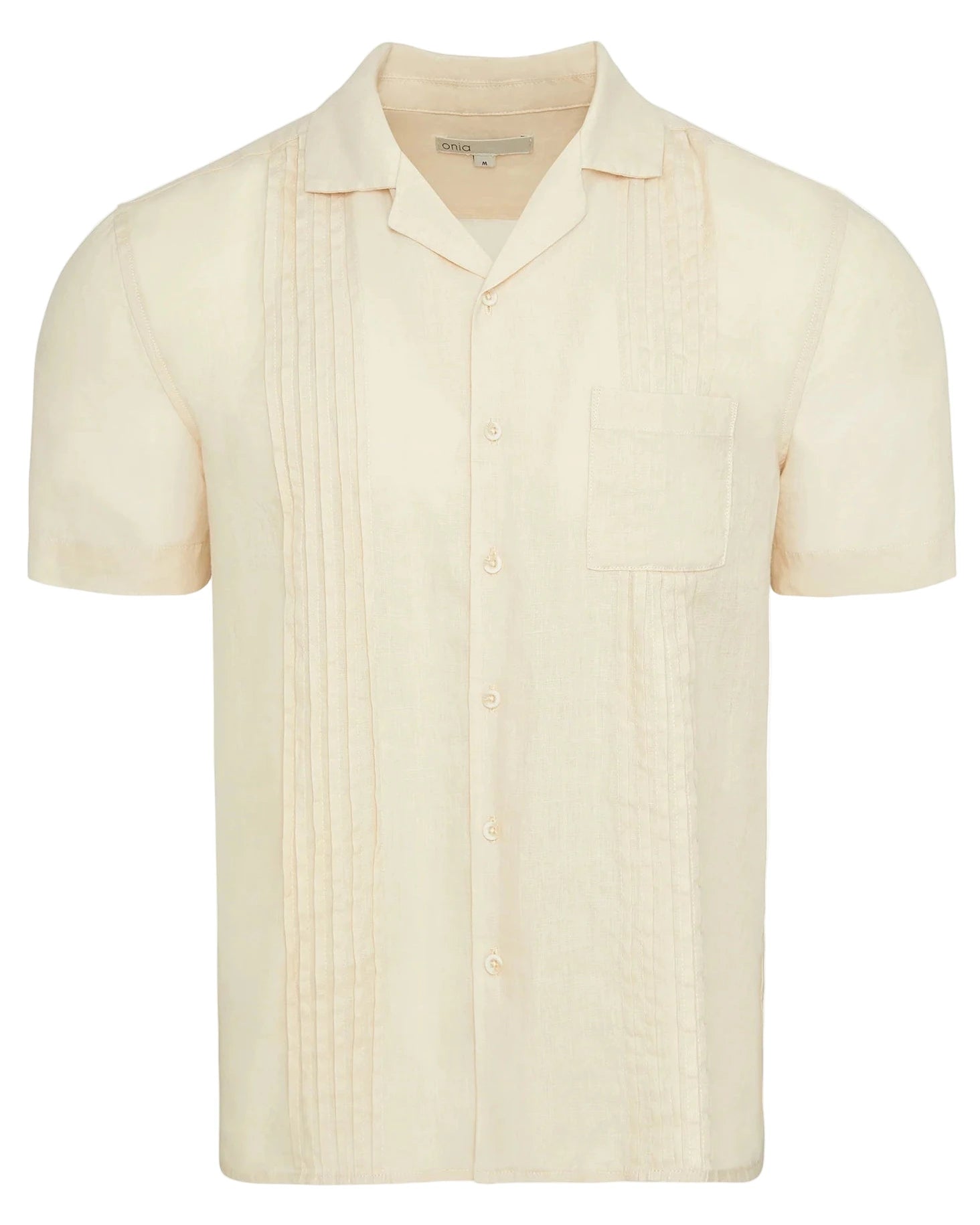 The Onia Linen Pintuck Camp Shirt is a light beige, pure linen short-sleeve shirt with a chest pocket and vertical pintuck pleats on the front.