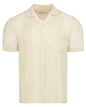 The Onia Linen Pintuck Camp Shirt is a light beige, pure linen short-sleeve shirt with a chest pocket and vertical pintuck pleats on the front.