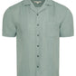 The Linen Pintuck Camp Shirt by Onia is a light green, pure linen short-sleeve shirt featuring a chest pocket and vertical pintuck pleats on the front.