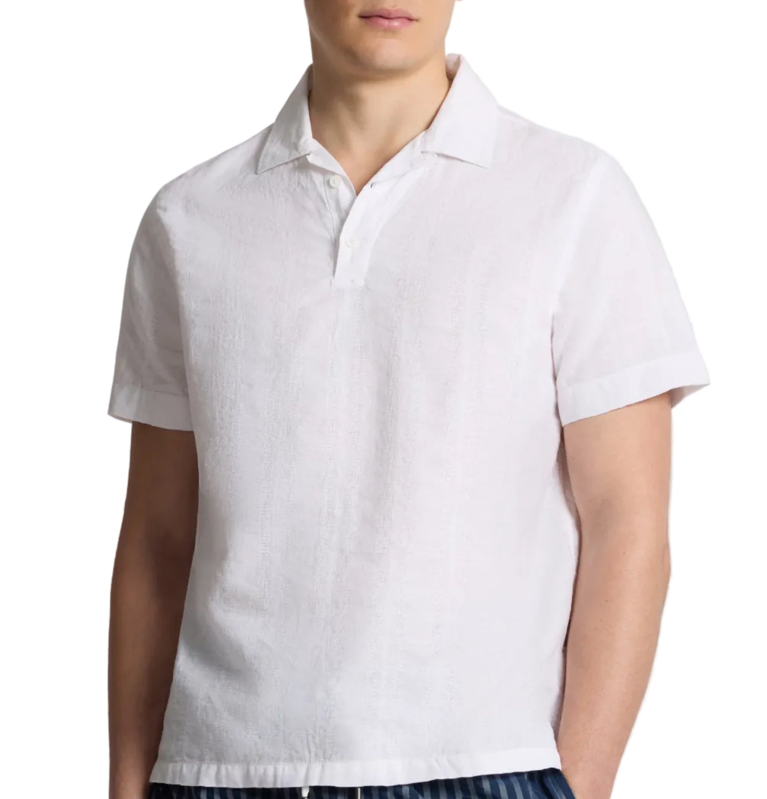 A man wears the Onia Cotton Linen Pop-Over Polo, a short-sleeve white top with a button placket, offering breathable comfort and a relaxed, casual silhouette against a plain background.
