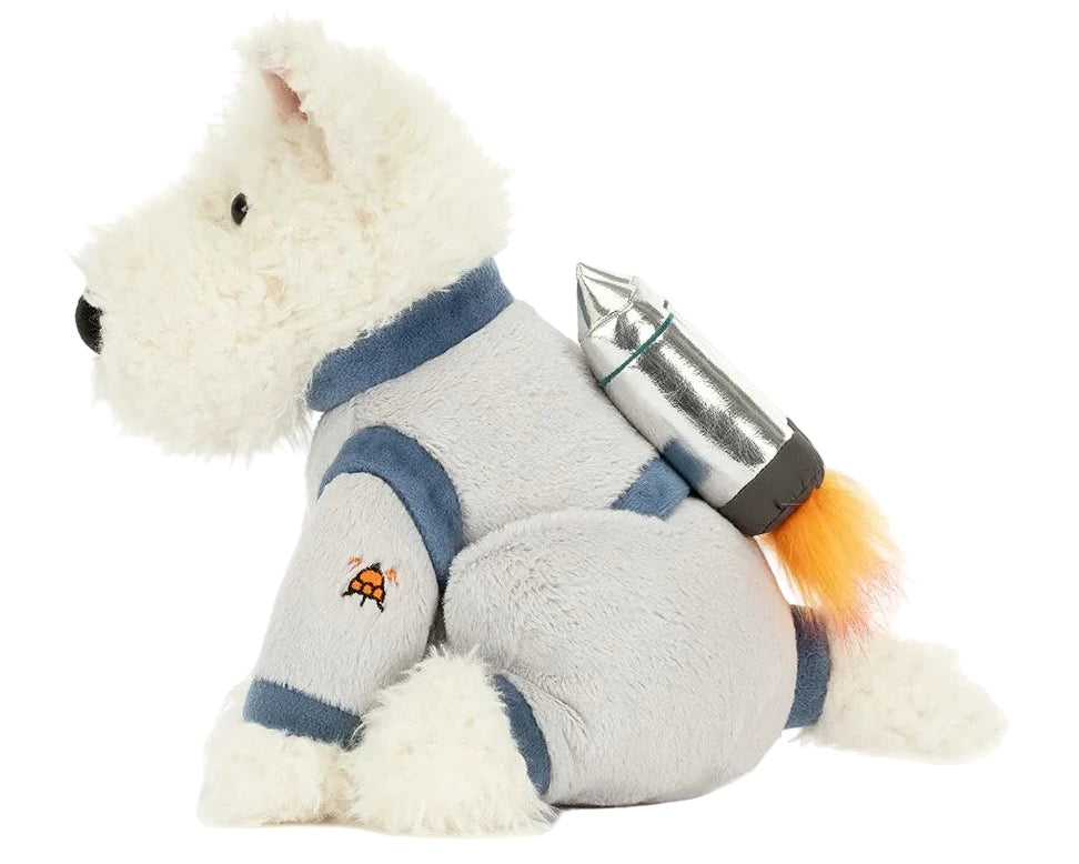 The Munro Scottie Dog Space Outfit by Jellycat features a plush white Scottie dog in a gray spacesuit with a rocket pack—a perfect gift for space dreamers and dog lovers alike!.