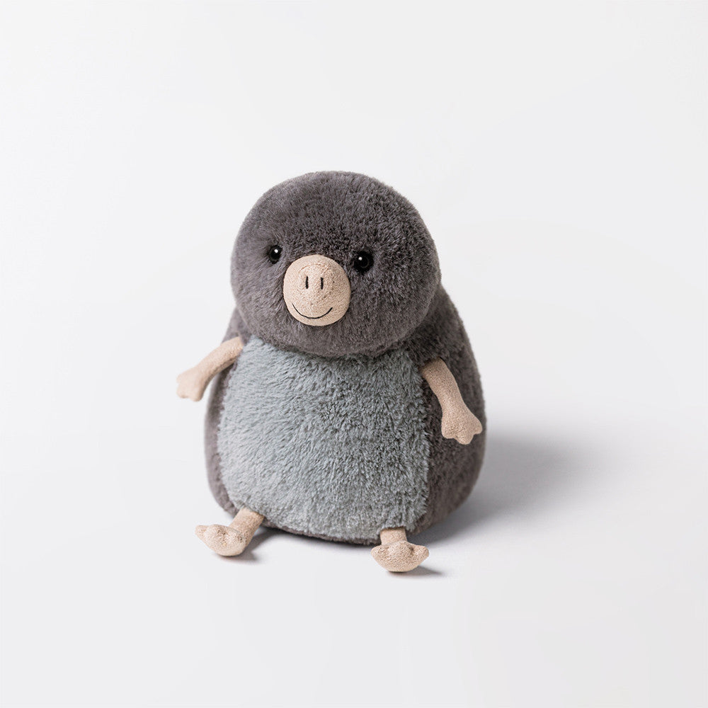 The Muswell Mole by Jellycat is a round, plush toy with a grey body, light grey belly, beige arms, feet, and nose, plus black stitched eyes—ready to join your adventures as it sits on a plain white background.