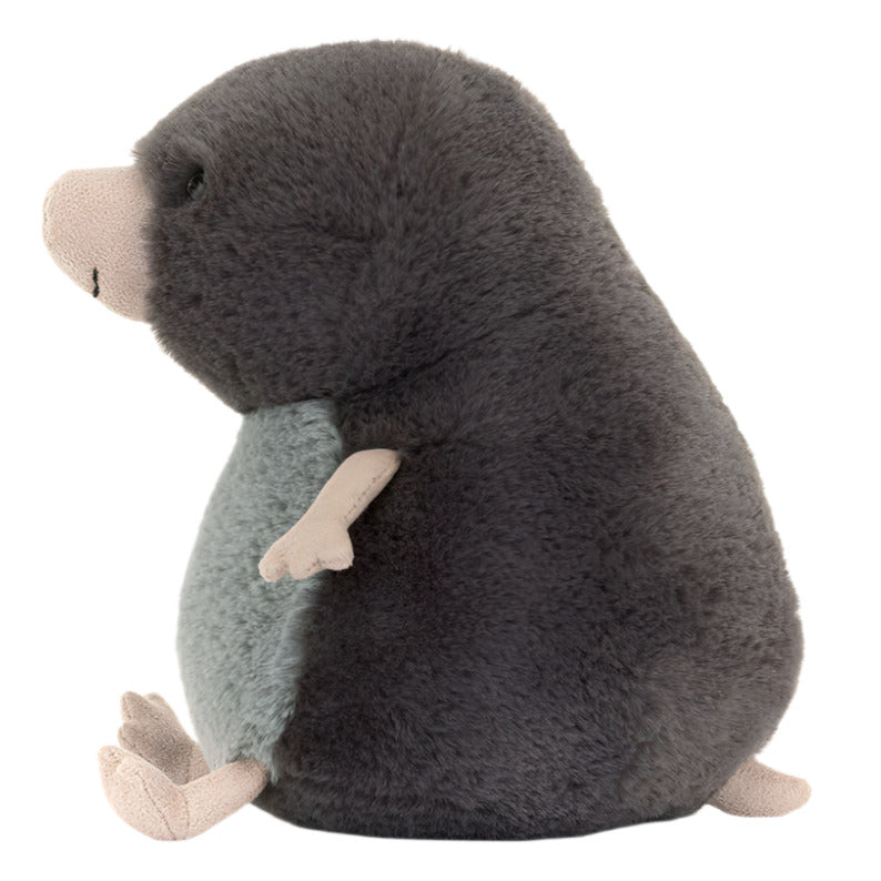 The Jellycat Muswell Mole is a plush toy featuring dark grey fur, a light grey belly, and pale pink limbs, designed to resemble the cave tour guide character in a side profile view.