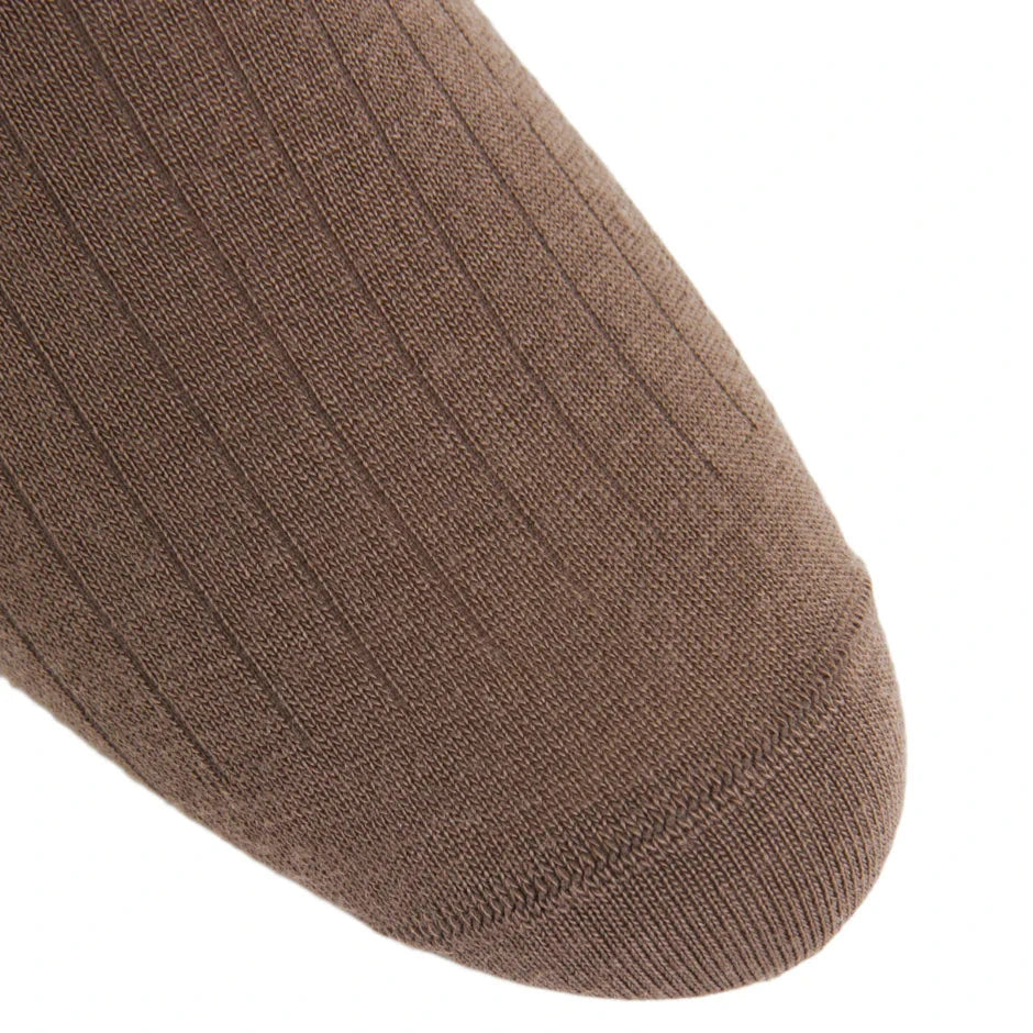 Close-up of the toe area of a brown Dapper Classics Mushroom Solid Ribbed Fine Merino Wool Sock (mid-calf, linked toe), men's dress socks made in North Carolina, shown against a white background.