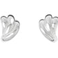 The Magda Earrings by Lie Studio are crafted in polished sterling silver with an abstract, curved design inspired by vintage silhouettes, shown against a white background.