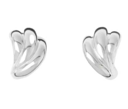 The Magda Earrings by Lie Studio are crafted in polished sterling silver with an abstract, curved design inspired by vintage silhouettes, shown against a white background.