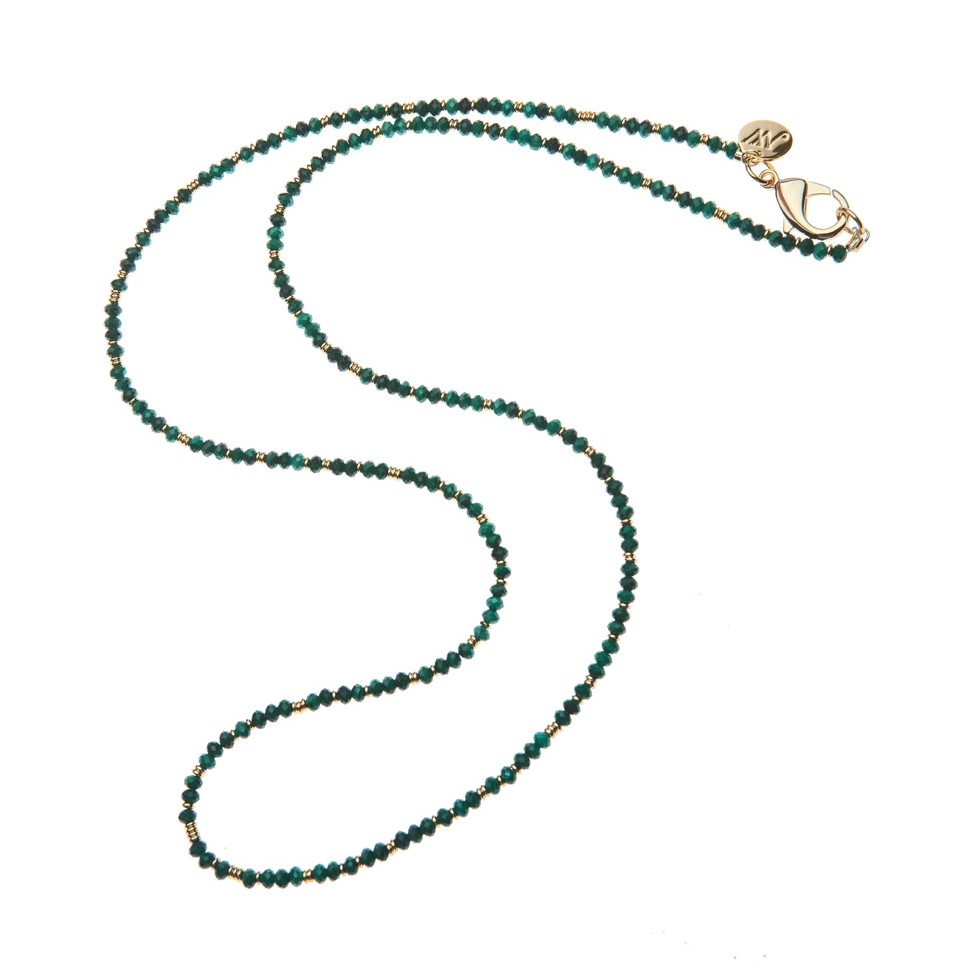 The Jane Win Double Wrap Beaded Necklace is a versatile piece adorned with small green and gold beads, featuring a gold clasp and a circular charm, displayed on a white background.