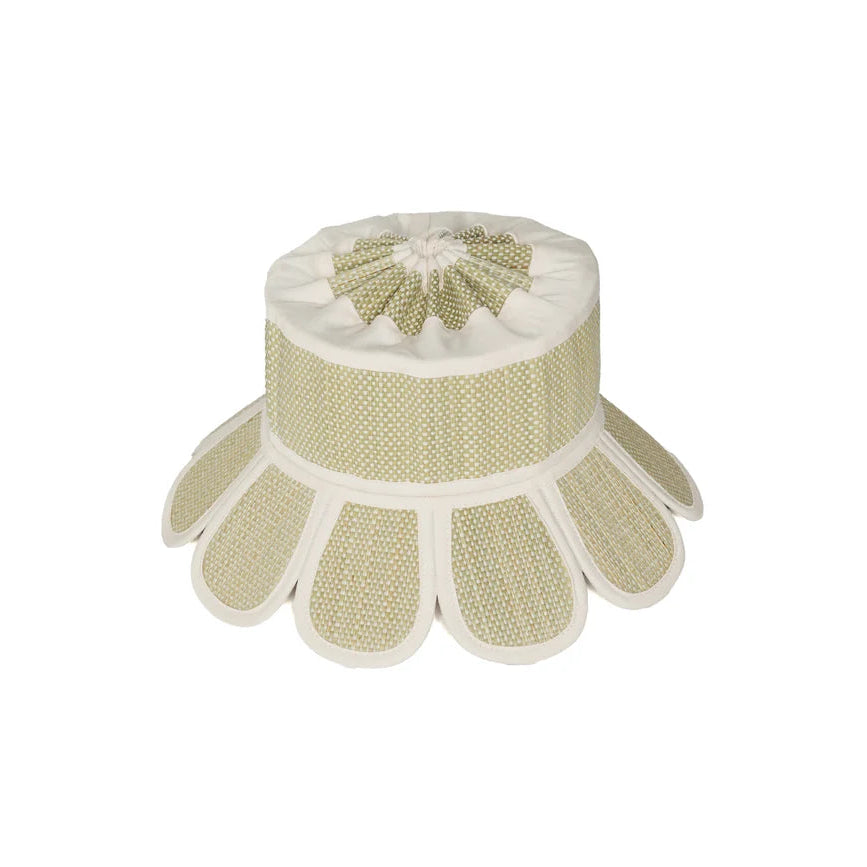 The Lorna Murray Manhattan Hat features a beige and white fabric design with a petal-like scalloped edge, echoing the elegant UPF 50+ sun hat silhouette, as seen from above on a plain white background.