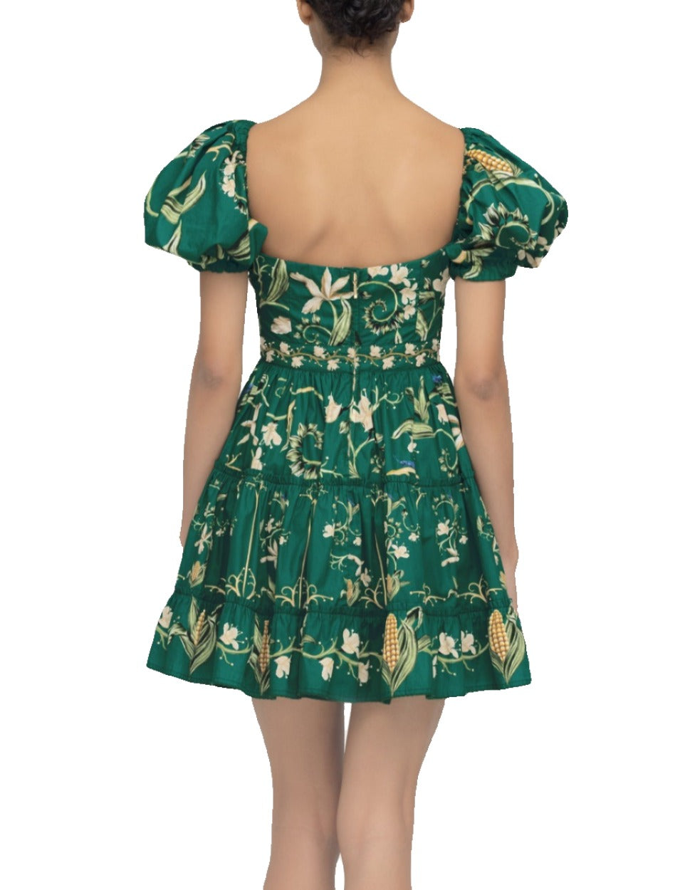 Woman from behind wearing the Agua by Aguabendita Manzanilla Dress, featuring a botanical print and puff sleeves, standing against a light background.