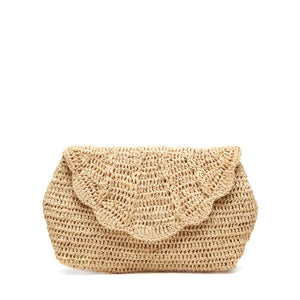 The Mar Y Sol Marcella Clutch is a stylish woven straw bag with a scalloped flap closure, ideal for summer soirées, shown against a plain white background.