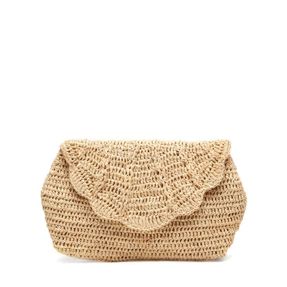 The Mar Y Sol Marcella Clutch is a stylish woven straw bag with a scalloped flap closure, ideal for summer soirées, shown against a plain white background.