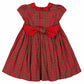 The Antoinette Baby Girls' and Girls' Marguerite Red Tartan Smocked Dress features festive red and green plaid, a red collar, matching buttons, and a large red bow at the waist—perfect for holiday celebrations.