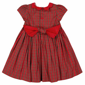 The Antoinette Baby Girls' and Girls' Marguerite Red Tartan Smocked Dress features festive red and green plaid, a red collar, matching buttons, and a large red bow at the waist—perfect for holiday celebrations.