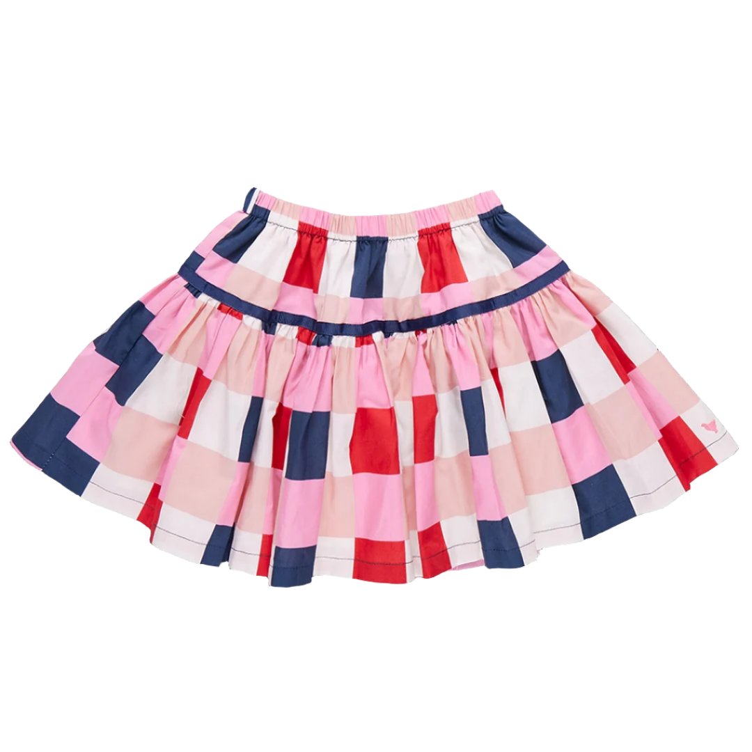 The Pink Chicken Girls' Maribelle Skirt by Pink Chicken is a multi-colored, knee-length skirt showcasing horizontal and vertical stripes in pink, red, white, and navy blue. Ideal for a back-to-school check, it features a gathered waistband and a flared hem.
