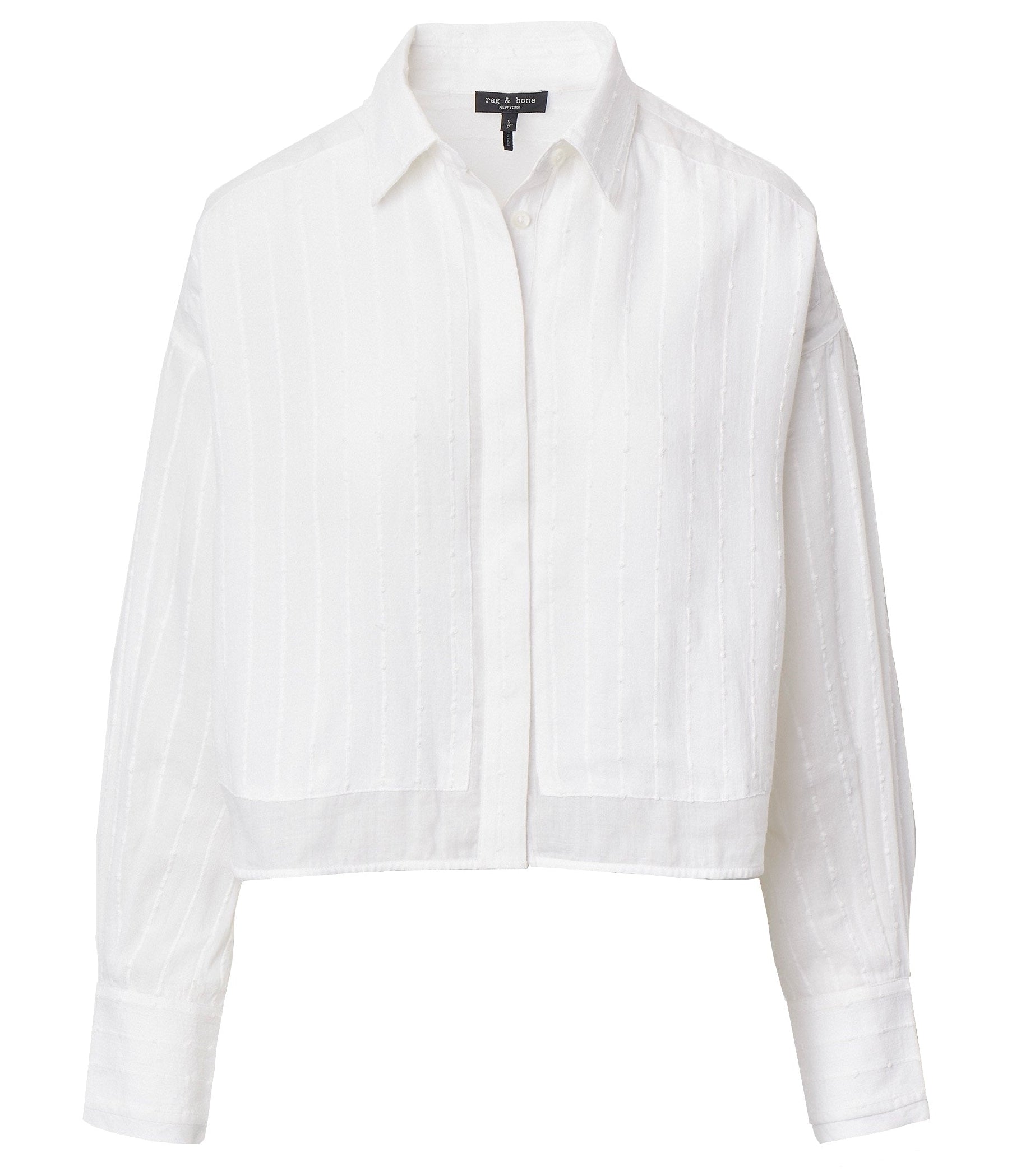 The Marin Combo Shirt by Rag & Bone is a white, long-sleeve cropped button-up with subtle vertical stripes, a relaxed fit, and a front button placket.