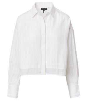 The Marin Combo Shirt by Rag & Bone is a white, long-sleeve cropped button-up with subtle vertical stripes, a relaxed fit, and a front button placket.