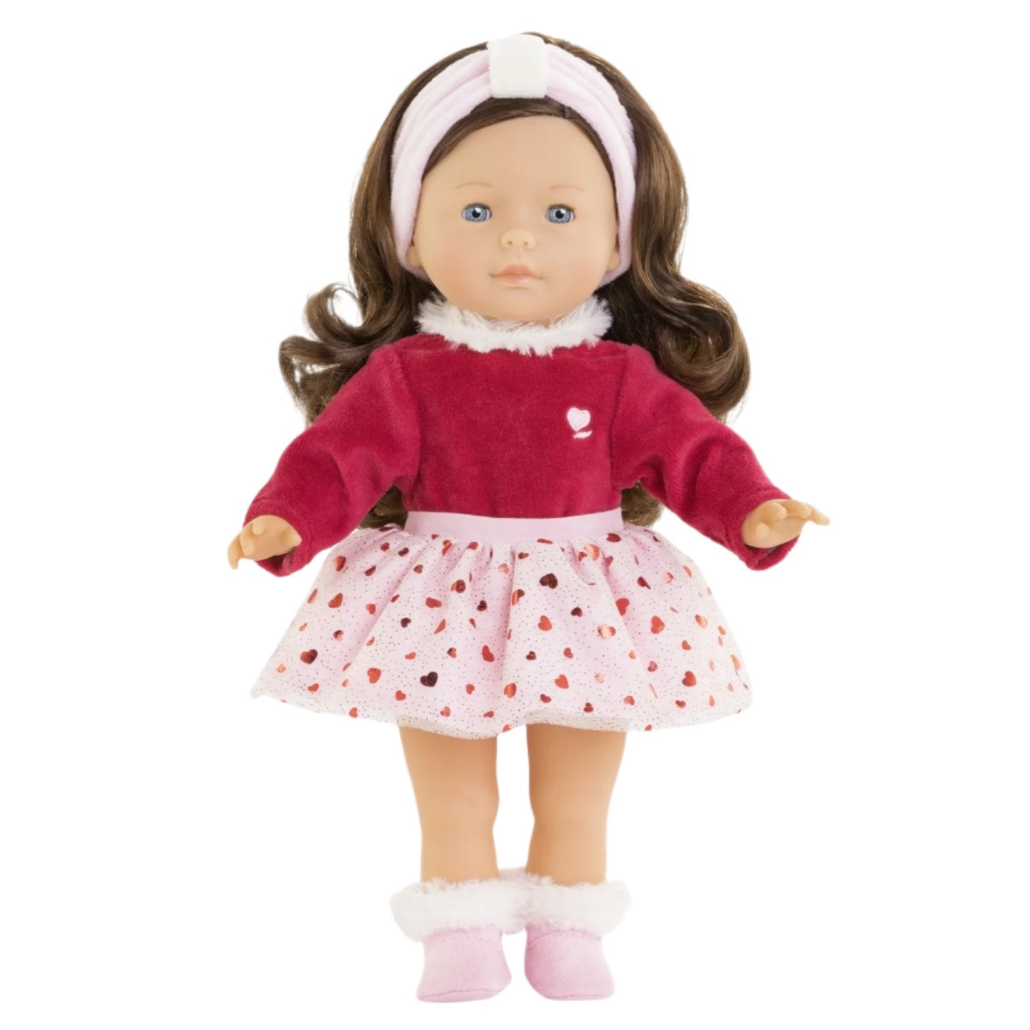 Introducing the Corolle Pearl Heart Petals Doll by Corolle, a limited edition doll with silky brown hair, dressed in a red top and a pink skirt decorated with heart patterns. She comes accessorized with a white headband and pink boots.