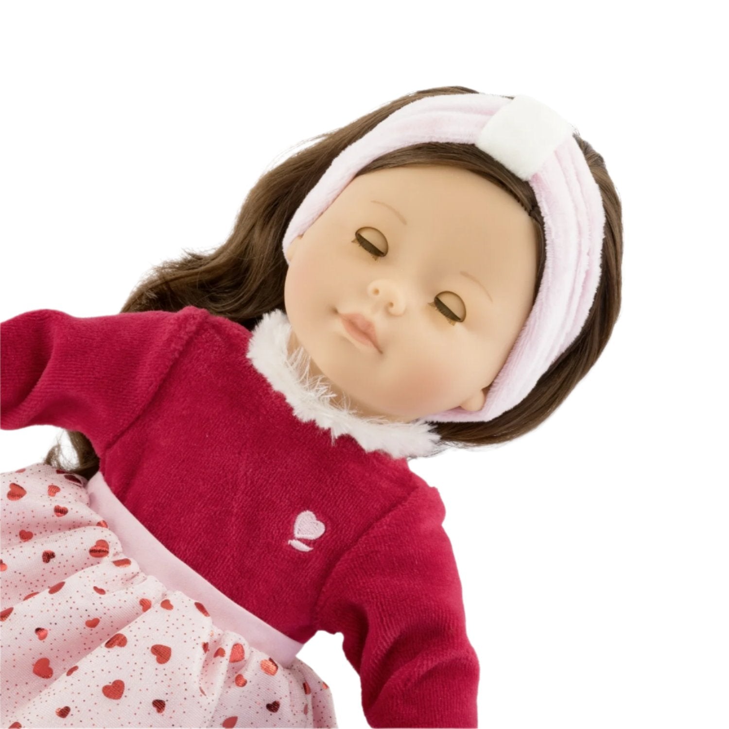 Introducing the Corolle Pearl Heart Petals Doll, a limited edition from Corolle, featuring silky brown hair and dressed in a charming red and white dress adorned with heart patterns, complete with a matching white headband.