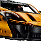 Discover the LEGO® Technic™ McLaren P1™ Hypercar from Legos - Toyhouse, a 1:8 scale model in orange with black accents. Photographed from a low angle, it embodies speed and precision with intricate design details.